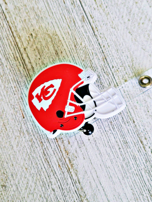 african american, reflections by zana, kansas city chiefs, helmet, badge reel, chiefs-themed badge holder, kansas city football helmet design, chiefs fan gear, nfl badge reel, football helmet badge accessory, chiefs office accessory, red and gold badge reel, kansas city sports merchandise, unique badge reel design, chiefs workwear, nfl team badge holder, chiefs pride, kansas city-themed work accessory, football fan gear, chiefs emblem badge holder, arrowhead badge reel, kansas city sports fan accessory
