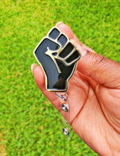 Load image into Gallery viewer, Black &amp; Gold Power Fist ID Badge Reel Metal for Work Afro African American Pride
